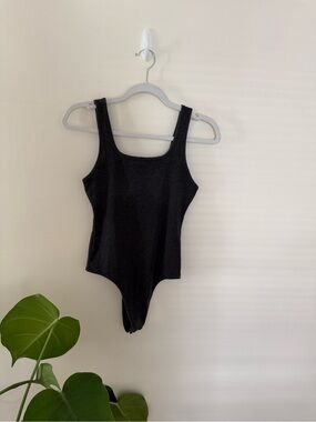 Black Ribbed One-Piece Bodysuit